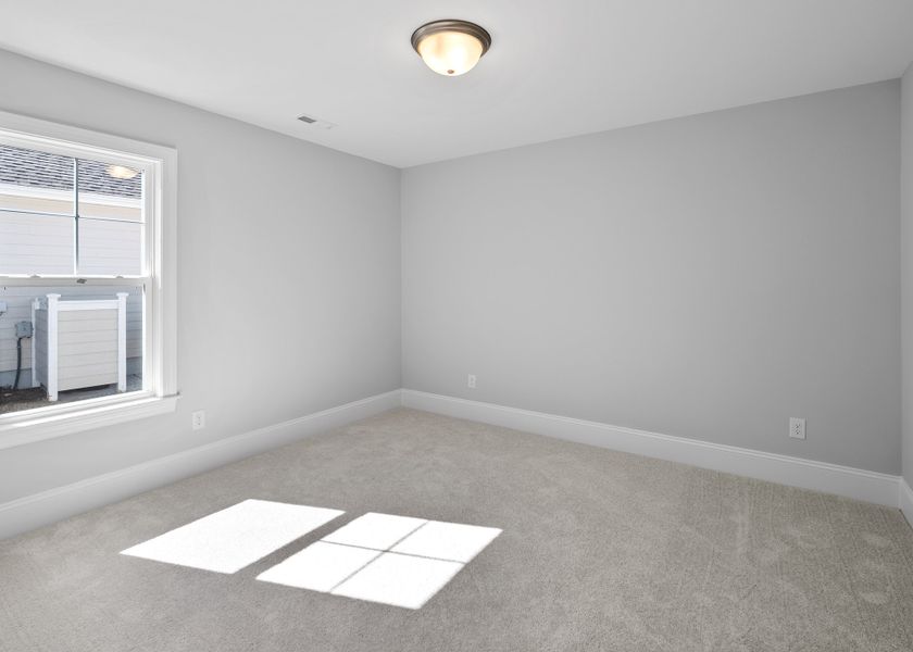 Spacious, unfurnished interior of a new home in Osprey Landing, Southport (Image 32).