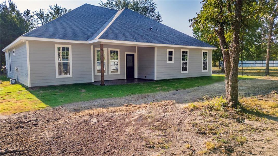 View of front of property with a front lawn