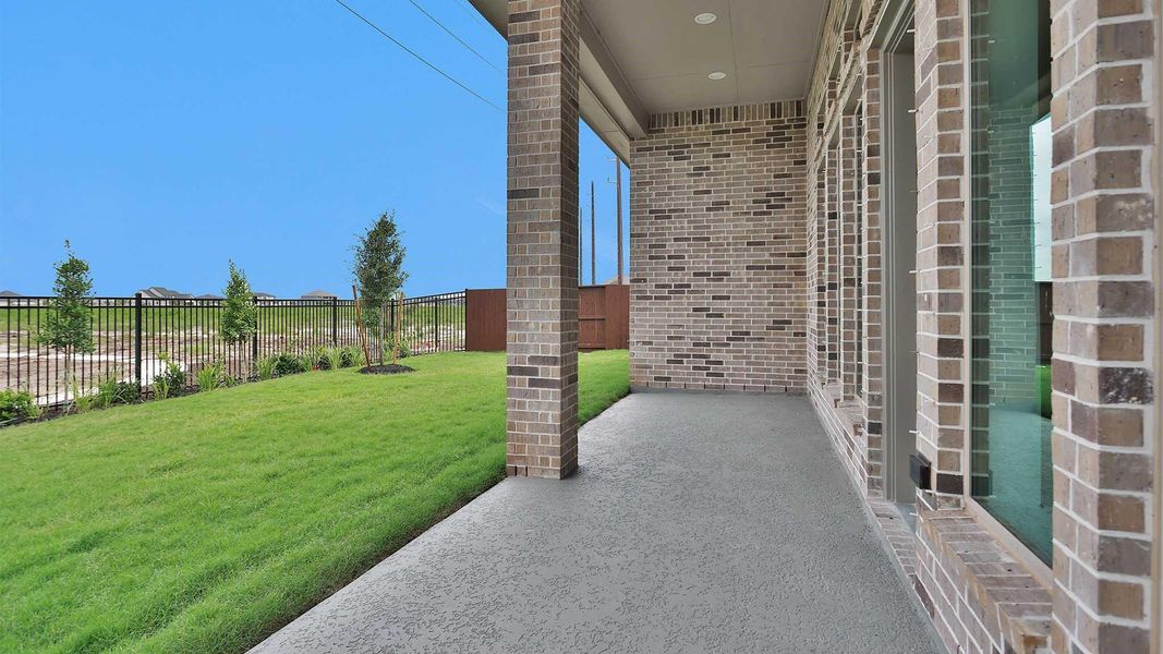 Exterior details and patio area of a home in Meridiana, Manvel (Image 3).
