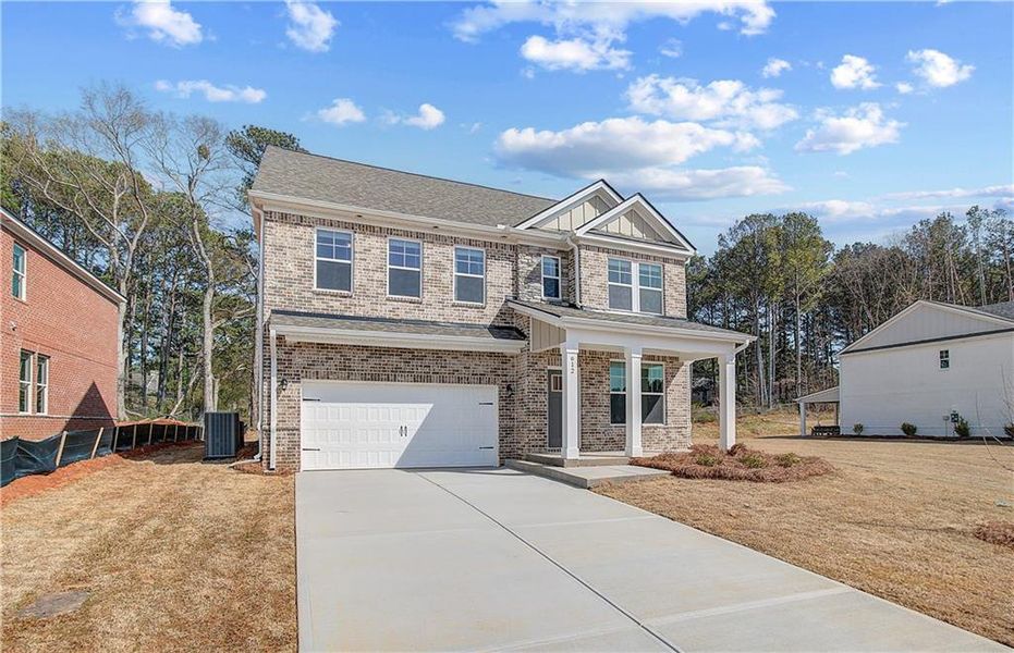 Front exterior of a new home in Bowers Farm, McDonough, GA, highlighting curb appeal (Image 16).
