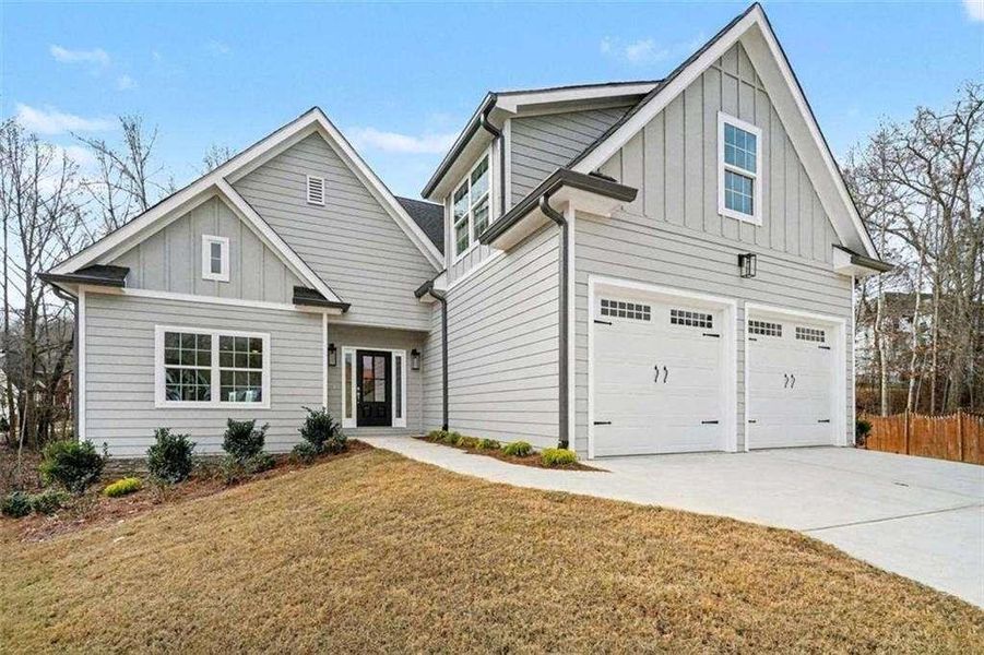 Front exterior of a new home in , Douglasville, GA, highlighting curb appeal (Image 2). Front exterior of a new home in , Douglasville, GA, highlighting curb appeal (Image 2).