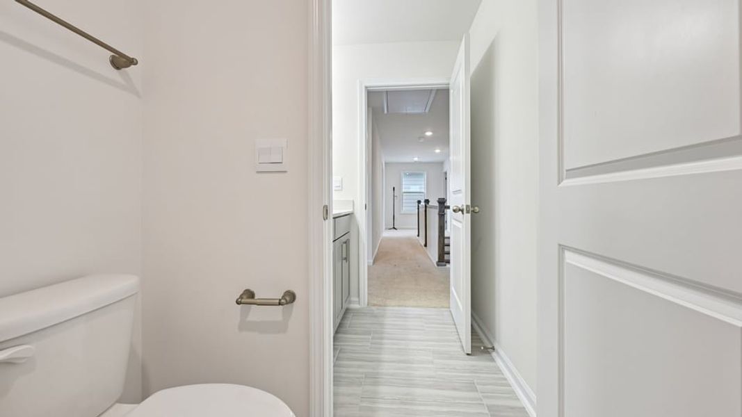 Furnished interior view inside a new home in The Estates Park, Apex (Image 10).