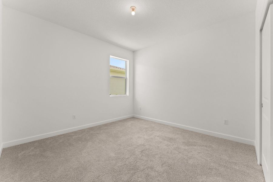 Spacious, unfurnished interior of a new home in Tradition - Cadence, Port St. Lucie (Image 9).