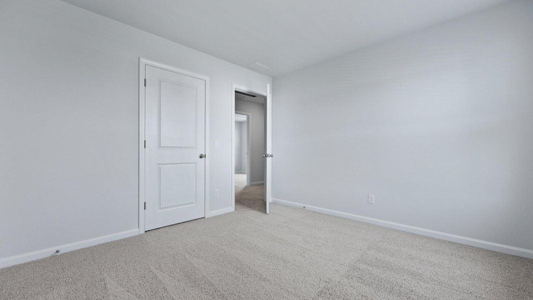 Spacious, unfurnished interior of a new home in Pine Hills at Cane Bay, Summerville (Image 19). Spacious, unfurnished interior of a new home in Pine Hills at Cane Bay, Summerville (Image 19).