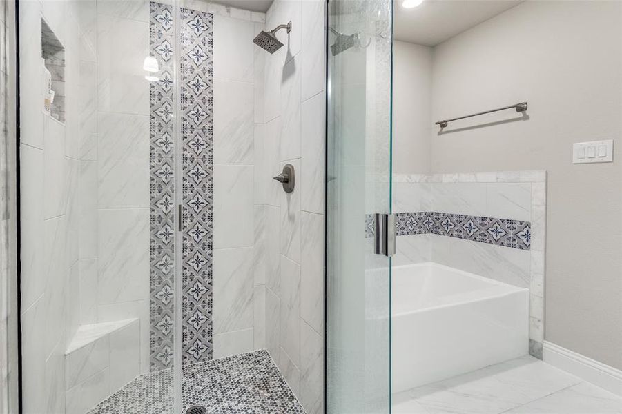 Bathroom with a stall shower and a garden tub Bathroom with a stall shower and a garden tub