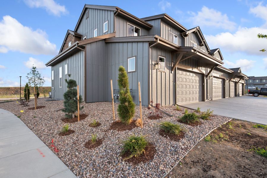 Front exterior of a new home in Vernazza, Windsor, CO, highlighting curb appeal (Image 2).