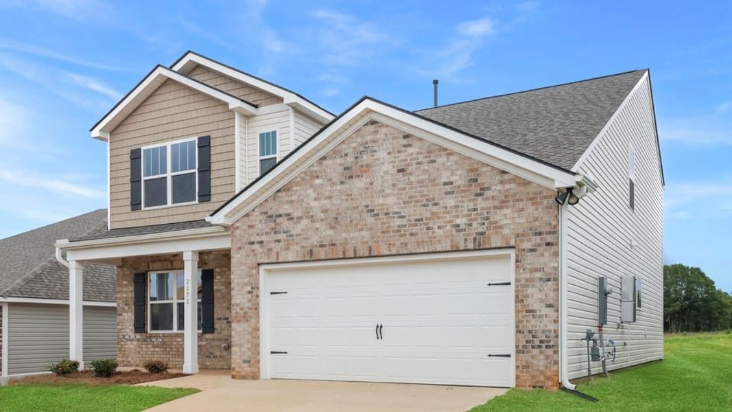 Front exterior of a new home in Baxter Village, Boiling Springs, SC, highlighting curb appeal (Image 2). Front exterior of a new home in Baxter Village, Boiling Springs, SC, highlighting curb appeal (Image 2).