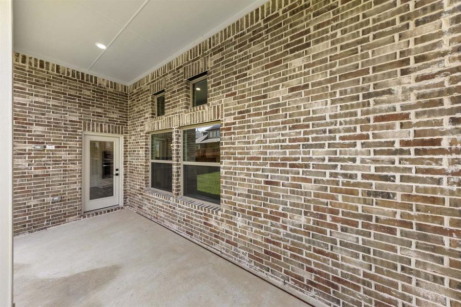 Exterior details and patio area of a home in River Ranch, Van Alstyne (Image 3). Exterior details and patio area of a home in River Ranch, Van Alstyne (Image 3).