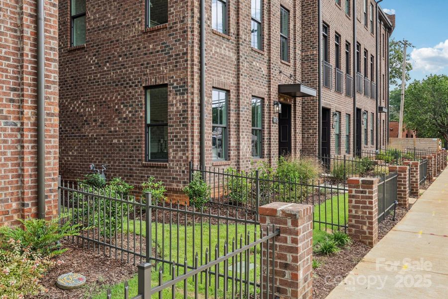 Exterior details and patio area of a home in Walk23, Huntersville (Image 21).