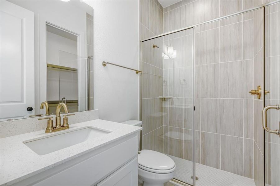 Full bathroom with a shower stall and vanity