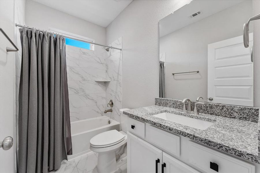 Secondary bathroom with granite countertops