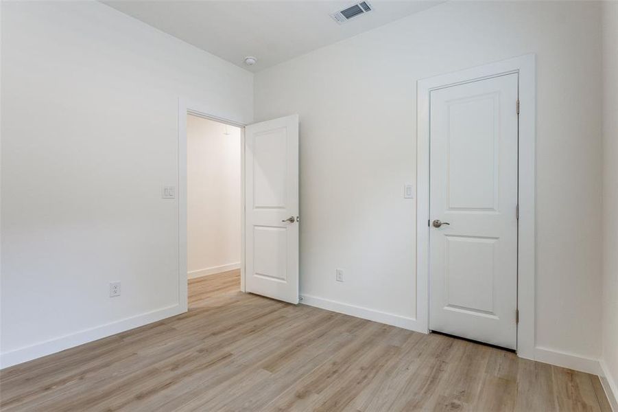 Unfurnished bedroom featuring light hardwood / wood-style floors