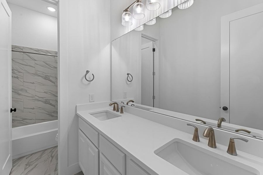 Bathroom #3 with double sinks and tub/shower combo. Bathroom #3 with double sinks and tub/shower combo.