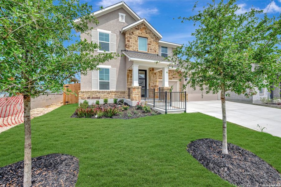 Front exterior of a new home in Davis Ranch 60', San Antonio, TX, highlighting curb appeal (Image 2). Front exterior of a new home in Davis Ranch 60', San Antonio, TX, highlighting curb appeal (Image 2).