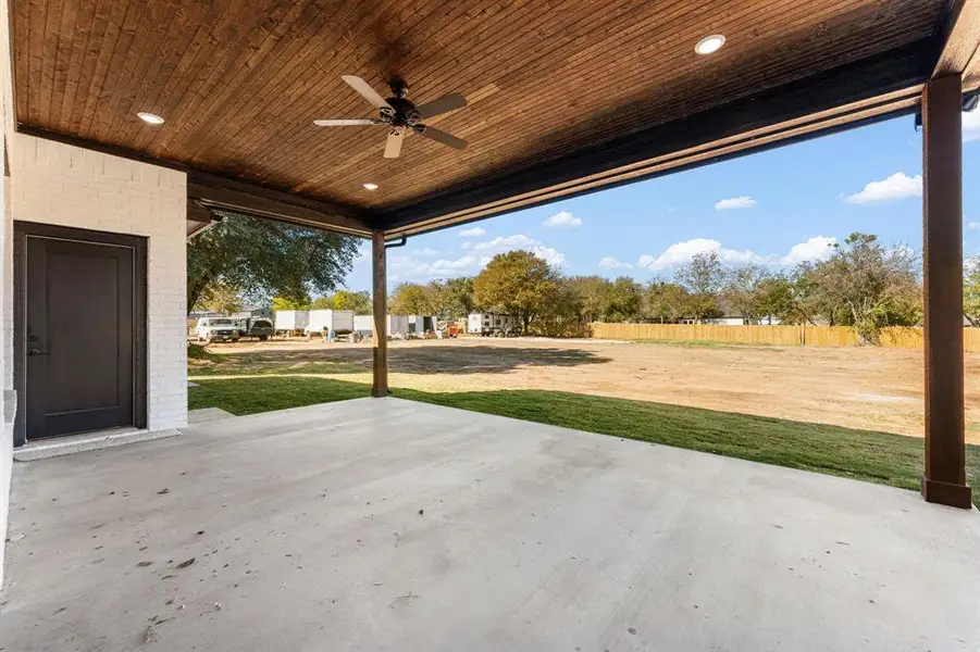 View of patio featuring a ceiling fan