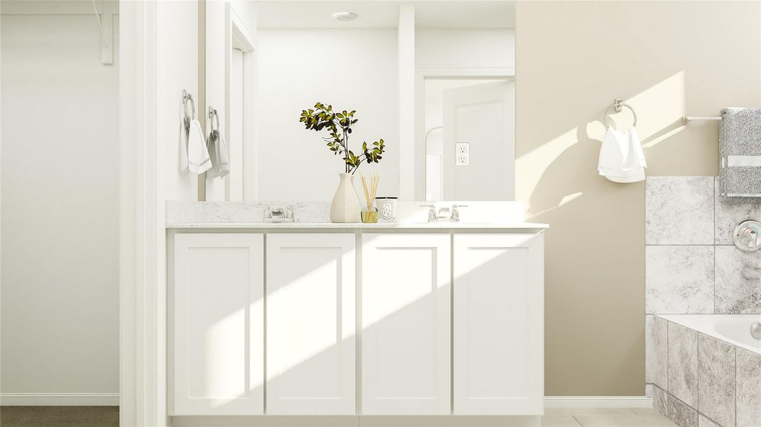 Full bath featuring double vanity and a bath Full bath featuring double vanity and a bath