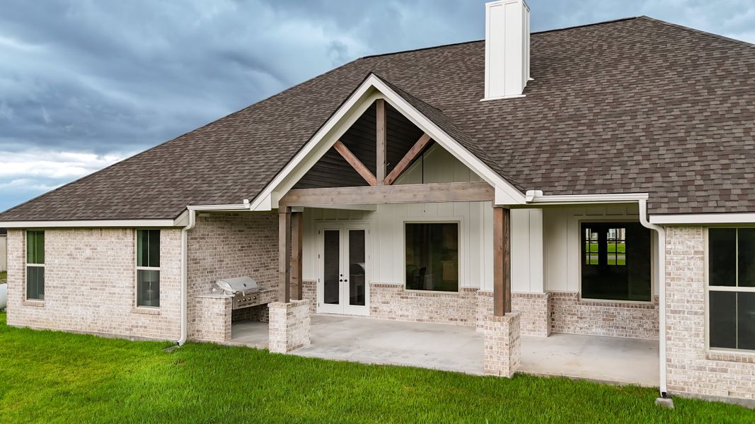 Exterior details and patio area of a home in Windmill Hill, Bryan (Image 29).