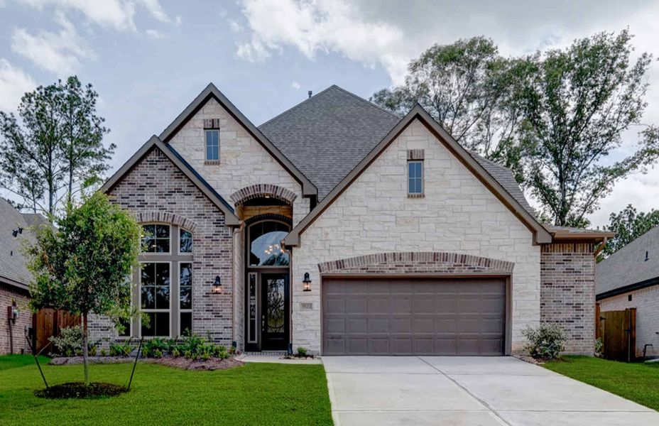 Representative exterior photo of a completed home built from the 2924 by Ravenna Homes in The Highlands 55′, Porter, TX (Image 2). Representative exterior photo of a completed home built from the 2924 by Ravenna Homes in The Highlands 55′, Porter, TX (Image 2).