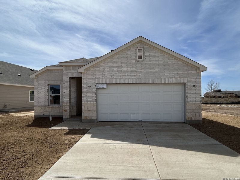 Front exterior of a new home in Hennersby Hollow, San Antonio, TX, highlighting curb appeal (Image 1). Front exterior of a new home in Hennersby Hollow, San Antonio, TX, highlighting curb appeal (Image 1).