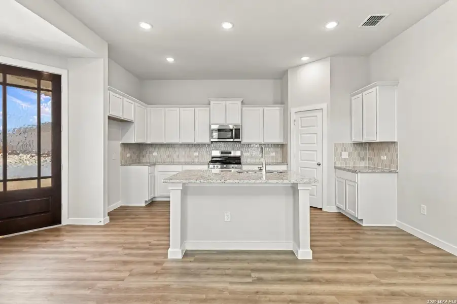 Furnished interior view inside a new home in Hunters Ranch, San Antonio (Image 8).
