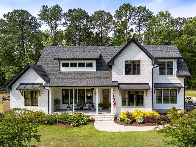 Front exterior of a new home in , Johns Island, SC, highlighting curb appeal (Image 21). Front exterior of a new home in , Johns Island, SC, highlighting curb appeal (Image 21).