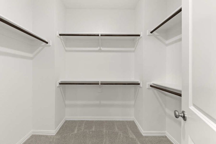 Brown plan primary walk in closet