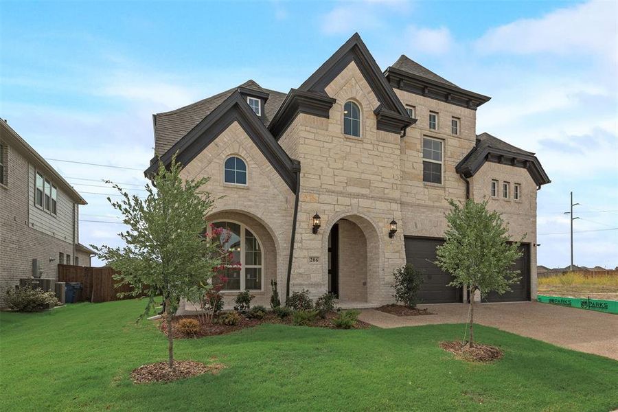 Front exterior of a new home in Dominion of Pleasant Valley, Wylie, TX, highlighting curb appeal (Image 2). Front exterior of a new home in Dominion of Pleasant Valley, Wylie, TX, highlighting curb appeal (Image 2).
