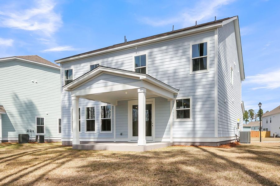 Exterior details and patio area of a home in Tidewater at Lakes of Cane Bay, Summerville (Image 3).