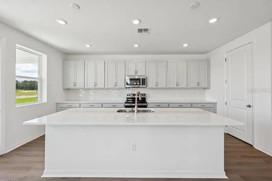 Furnished interior view inside a new home in Trailside, Mount Dora (Image 11). Furnished interior view inside a new home in Trailside, Mount Dora (Image 11).