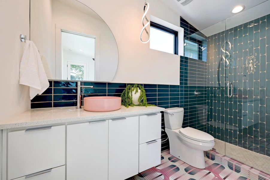 Full bath with vanity, a shower stall, backsplash, tile patterned flooring, and recessed lighting
