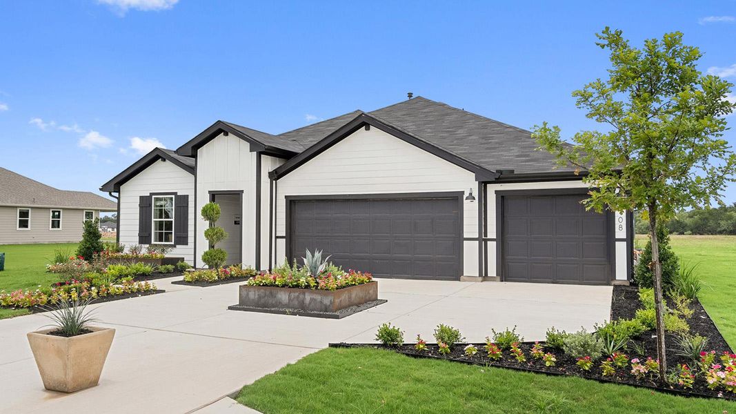 Front exterior of a new home in Railhead, Cedar Creek, TX, highlighting curb appeal (Image 2). Front exterior of a new home in Railhead, Cedar Creek, TX, highlighting curb appeal (Image 2).