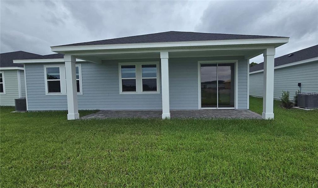 Exterior details and patio area of a home in Colbert Landings, Palm Coast (Image 4).