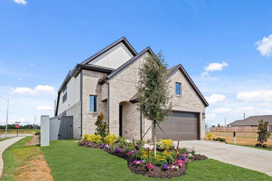 Front exterior of a new home in Jubilee 40', Hockley, TX, highlighting curb appeal (Image 22). Front exterior of a new home in Jubilee 40', Hockley, TX, highlighting curb appeal (Image 22).