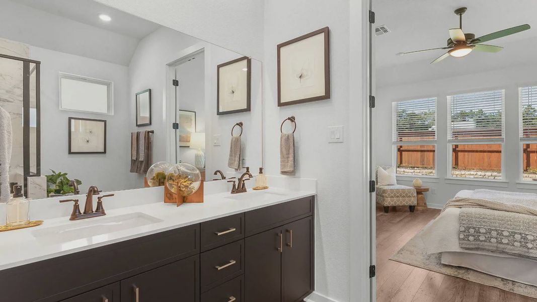 Representative furnished interior of a home built from the Brooks by Chesmar Homes in University Heights, Round Rock (Image 17).