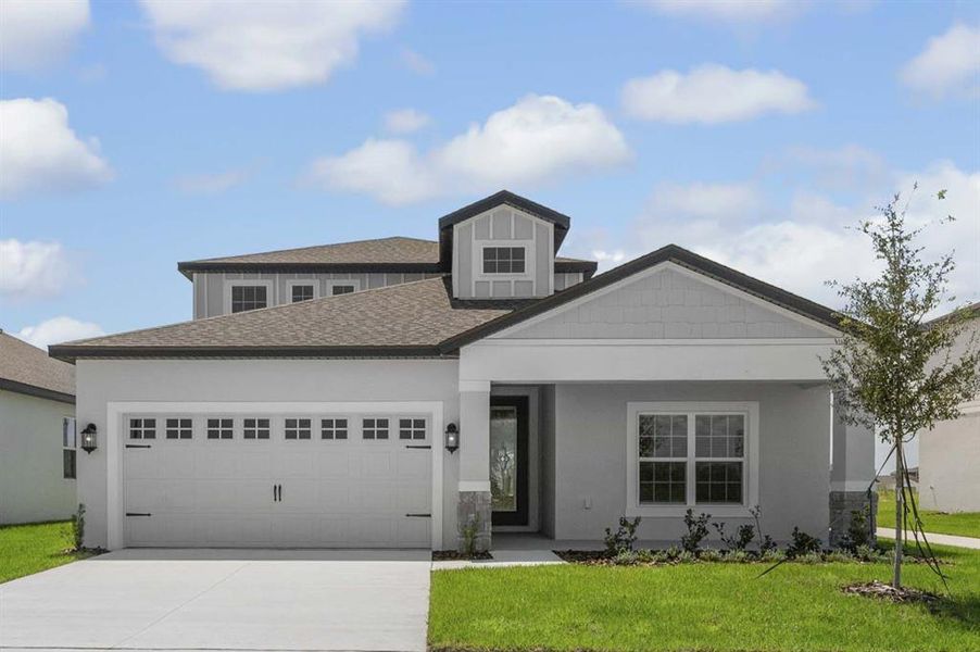 Front exterior of a new home in Gum Lake Preserve, Lake Alfred, FL, highlighting curb appeal (Image 1).