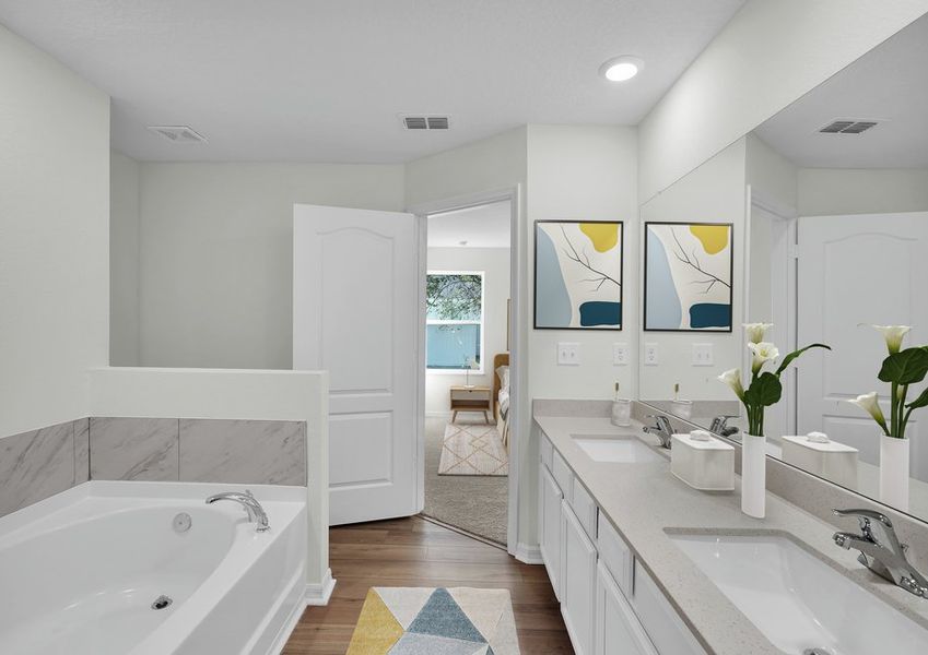 Get ready for your day in the spacious master bathroom