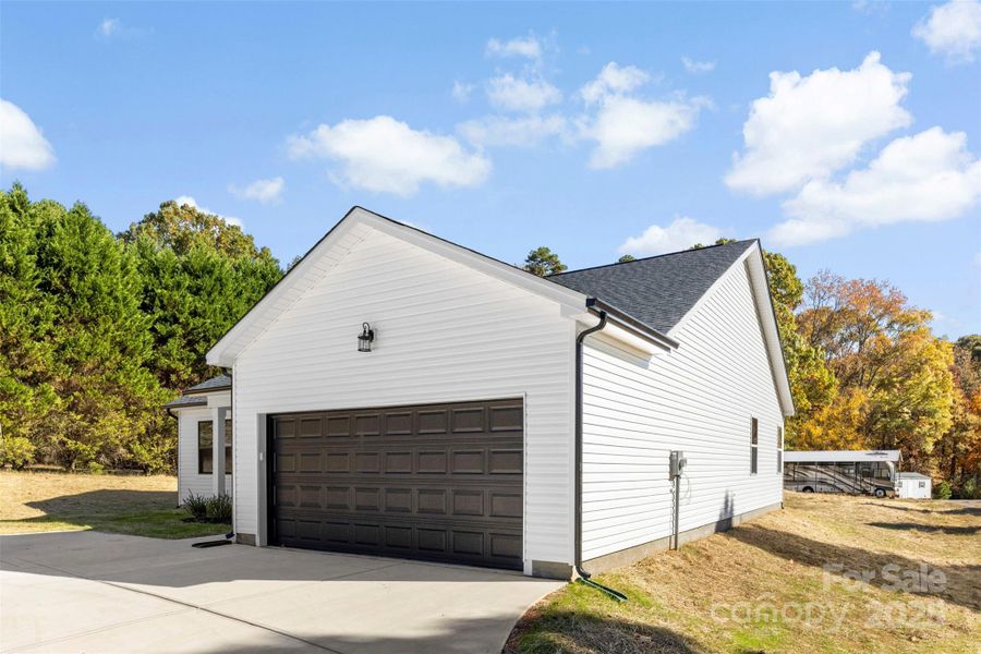 Front exterior of a new home in , Monroe, NC, highlighting curb appeal (Image 20).