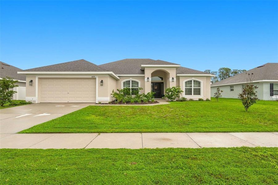 Front exterior of a new home in Knights Landing, Lakeland, FL, highlighting curb appeal (Image 2). Front exterior of a new home in Knights Landing, Lakeland, FL, highlighting curb appeal (Image 2).
