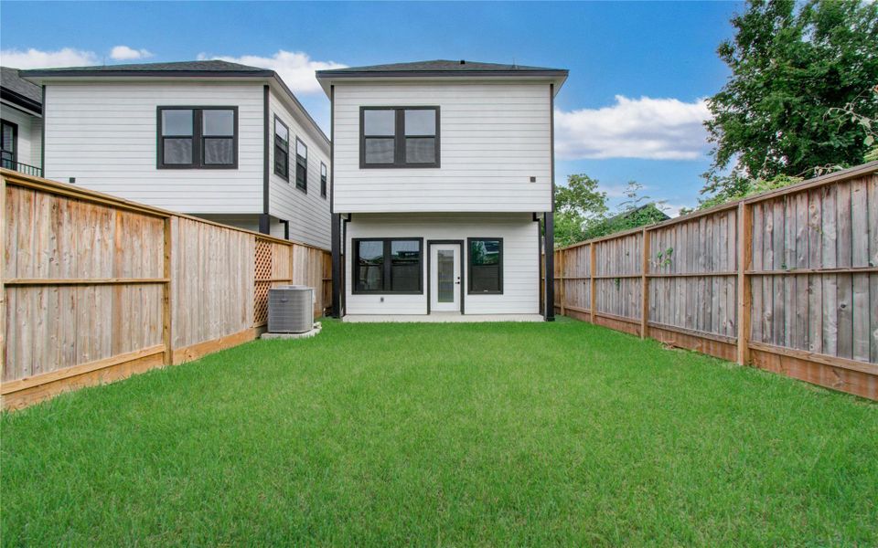 Spacious yard! High wooden fences for privacy.