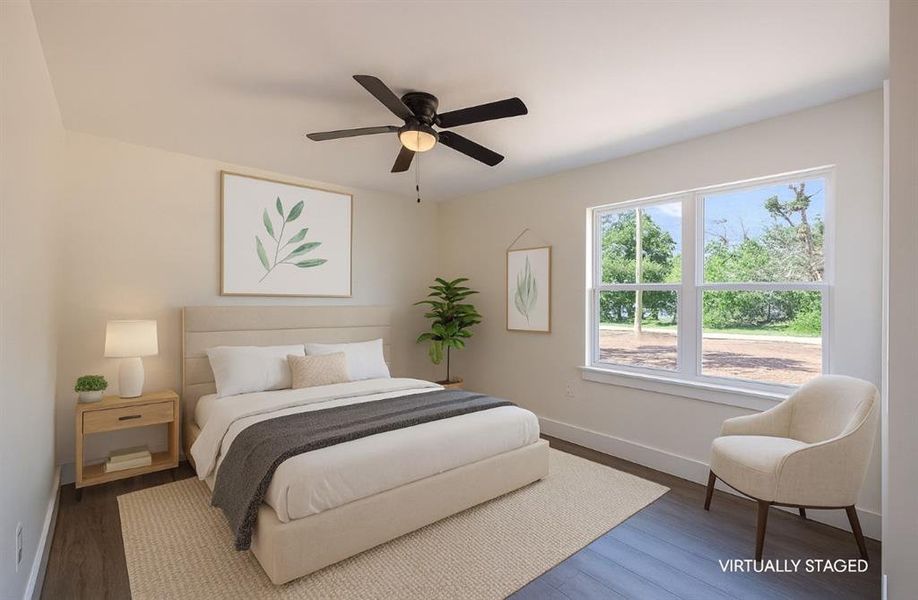 Bedroom with dark wood-type flooring and ceiling fan