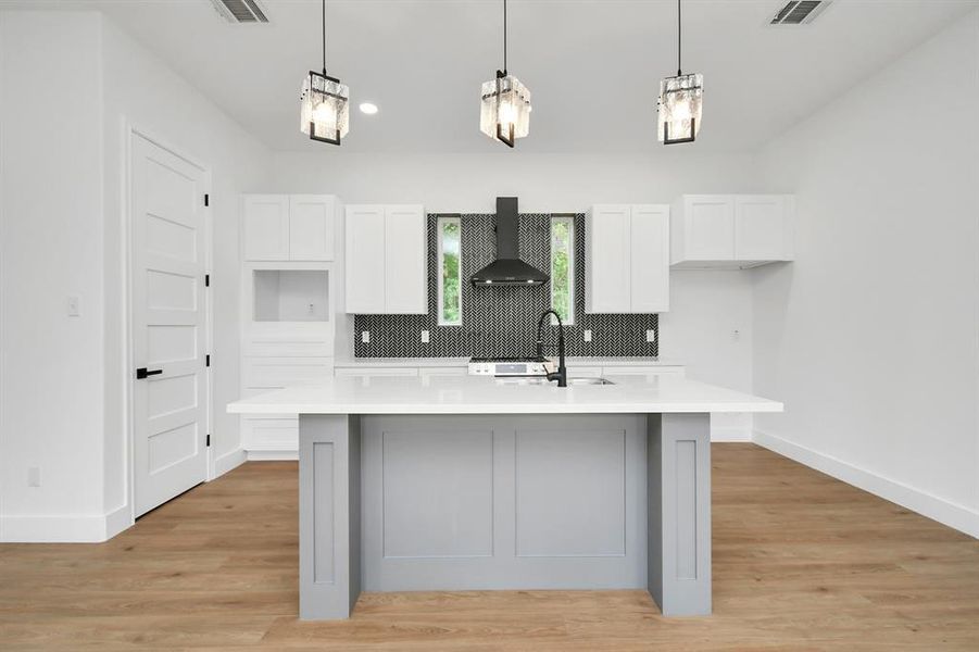 The kitchen, an integral part of this home's open- concept design, seamleslly flows off the living room, creating a harmonious and connected living space.