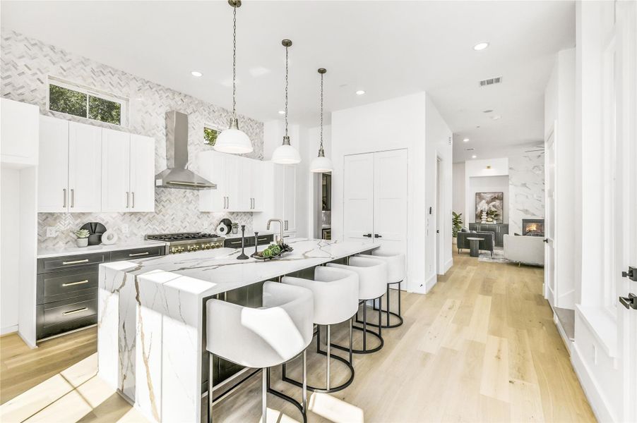 Every inch of this space reflects intentional design—from the integrated microwave drawer and built-in dishwasher to the dual pantries and designer millwork. The open flow from kitchen to living area allows for seamless entertaining, creating the ideal balance of private retreat and social gathering space.