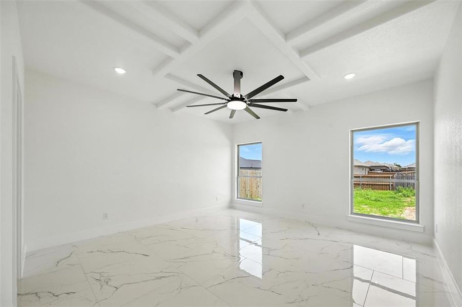 Spare room with marble finish flooring, beamed ceiling, recessed lighting, coffered ceiling, and ceiling fan
