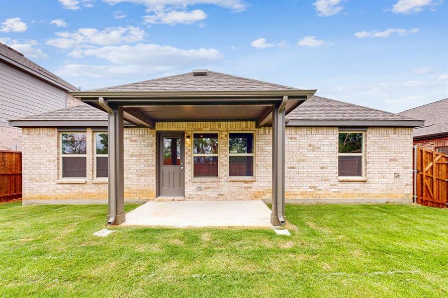Front exterior of a new home in Kings Way, Denton, TX, highlighting curb appeal (Image 15).