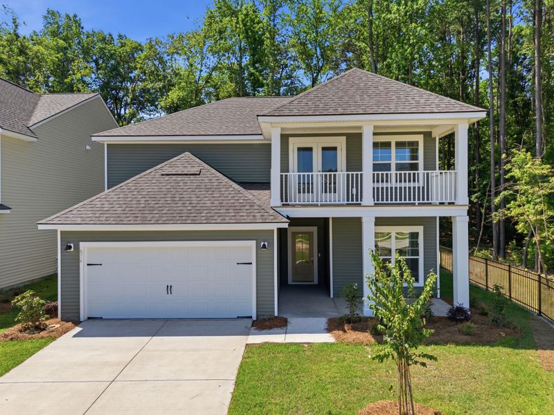 Front exterior of a new home in Grand Arbor, Blythewood, SC, highlighting curb appeal (Image 2). Front exterior of a new home in Grand Arbor, Blythewood, SC, highlighting curb appeal (Image 2).