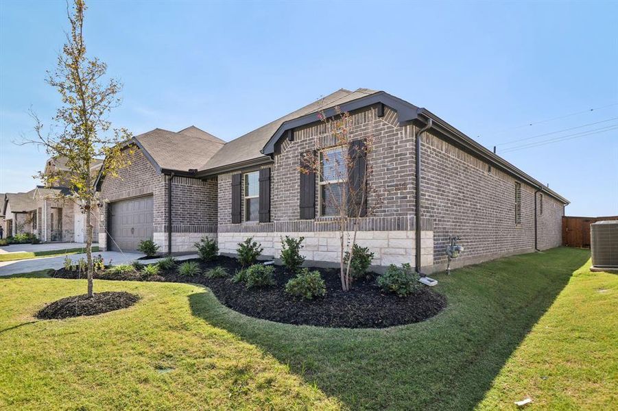 Exterior details and patio area of a home in Lakehaven - Premier Series, Farmersville (Image 3).