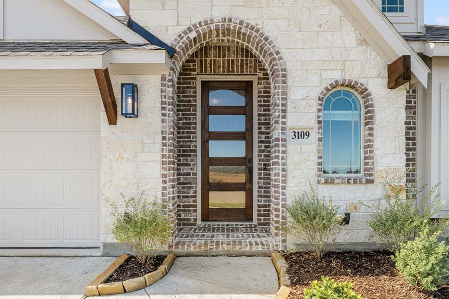 Front exterior of a new home in Glenwood Meadows, Denton, TX, highlighting curb appeal (Image 2). Front exterior of a new home in Glenwood Meadows, Denton, TX, highlighting curb appeal (Image 2).