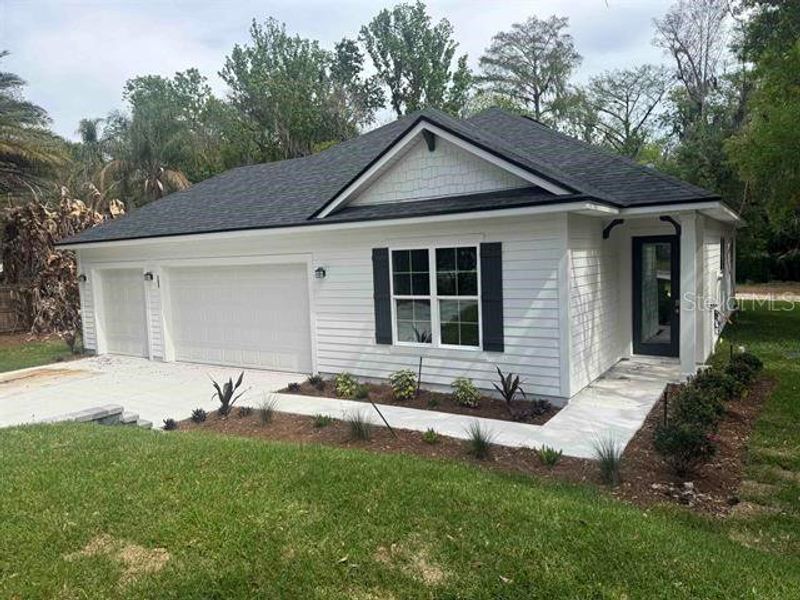 Front exterior of a new home in , East Palatka, FL, highlighting curb appeal (Image 1). Front exterior of a new home in , East Palatka, FL, highlighting curb appeal (Image 1).