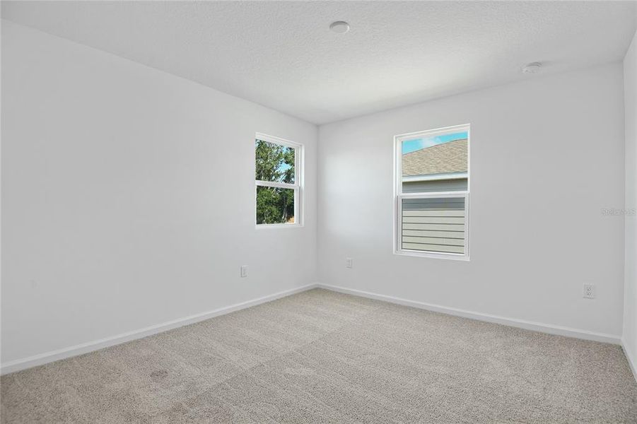 Spacious, unfurnished interior of a new home in Seasons at Shores of Lake Dell, Dundee (Image 7).