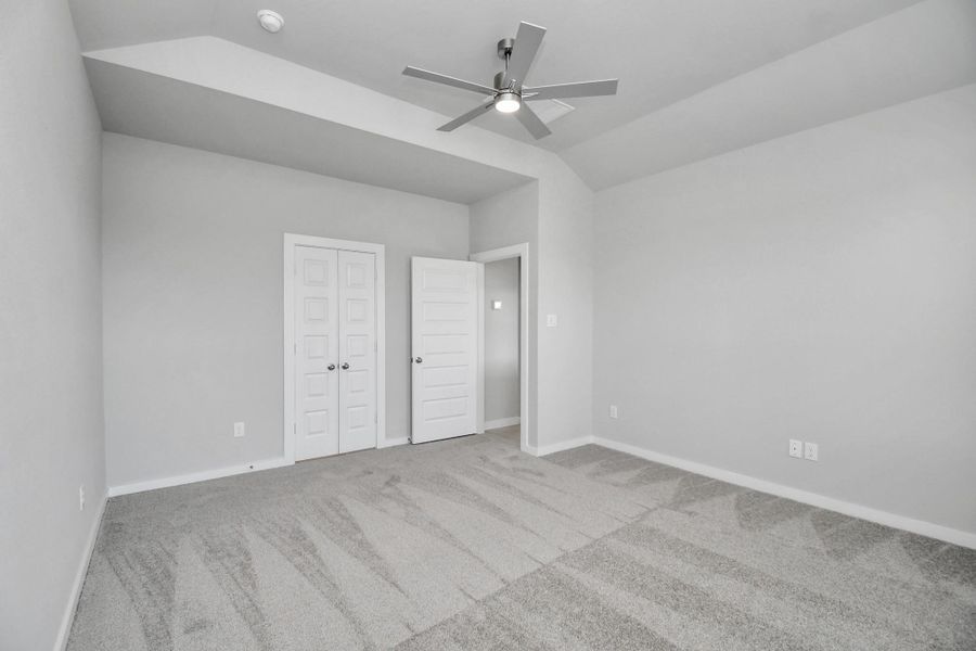 Escape and relax in the exquisite primary suite, a haven to unwind after a long day. The spacious room, boasts plush carpeting, soothing paint tones, high ceilings, and expansive windows adorned with privacy blinds. Sample photo of completed home with similar floor plan. Actual colors and selections may vary. Escape and relax in the exquisite primary suite, a haven to unwind after a long day. The spacious room, boasts plush carpeting, soothing paint tones, high ceilings, and expansive windows adorned with privacy blinds. Sample photo of completed home with similar floor plan. Actual colors and selections may vary.